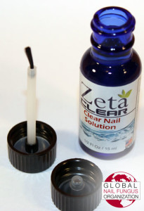 Open Zetaclear topical bottle with applicator brush and lid